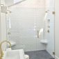 Auckland bathroom tiling project by Top End Tiling: Stylish bathroom with subway wall and herringbone shower floor tiles.