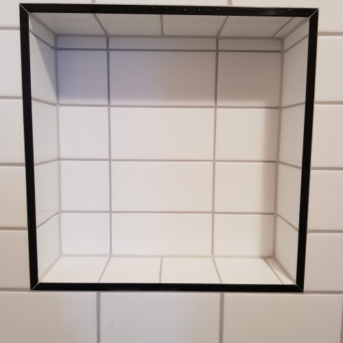 Top End Tiling Auckland project: Expertly tiled shower with custom shower niche design. NZ tiling solutions.