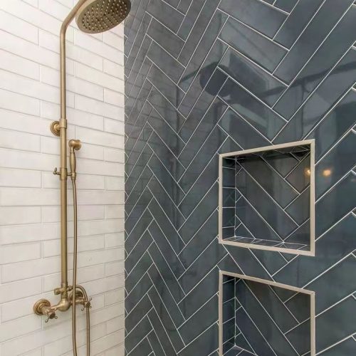 Top End Tiling Auckland project: Expertly tiled shower with custom shower niche design. NZ tiling solutions.