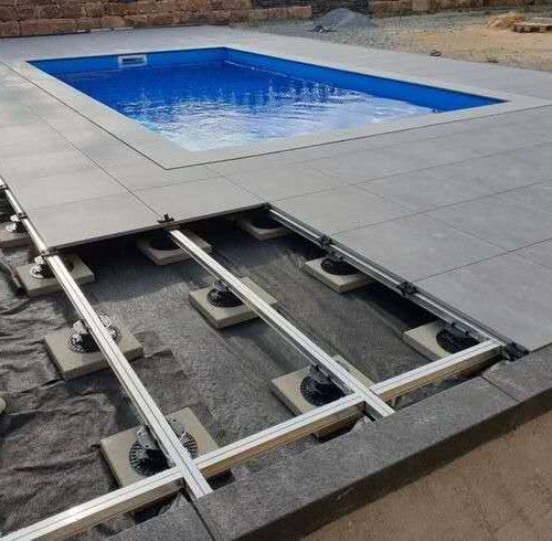 Expert outdoor tiling with adjustable deck jacks by Top End Tiling, ensuring perfectly level surfaces in Auckland.