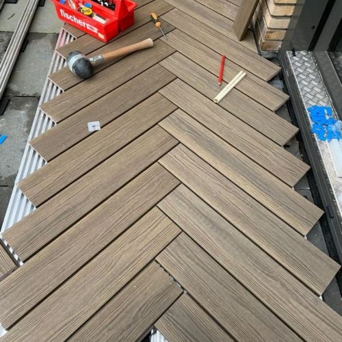 deck jacks Auckland tiling project using deck jacks for raised outdoor flooring. Top End Tiling's precision installation.