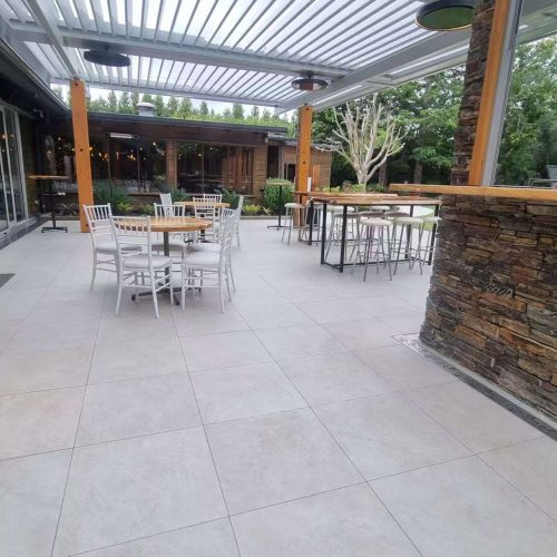 outdoor tiling Top End Tiling vineyard project: Expertly installed non-slip outdoor tiling for a modern and functional patio space.